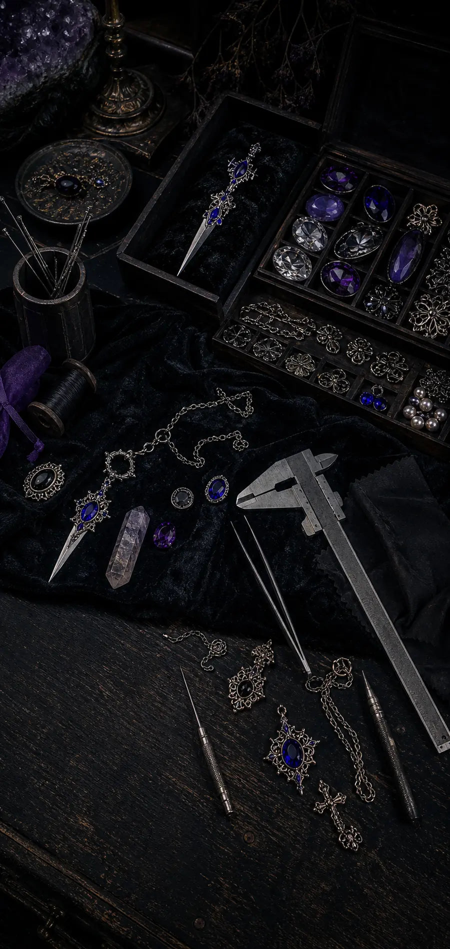 Dark artisan workbench with DIY tools, gemstone boxes, and pearls